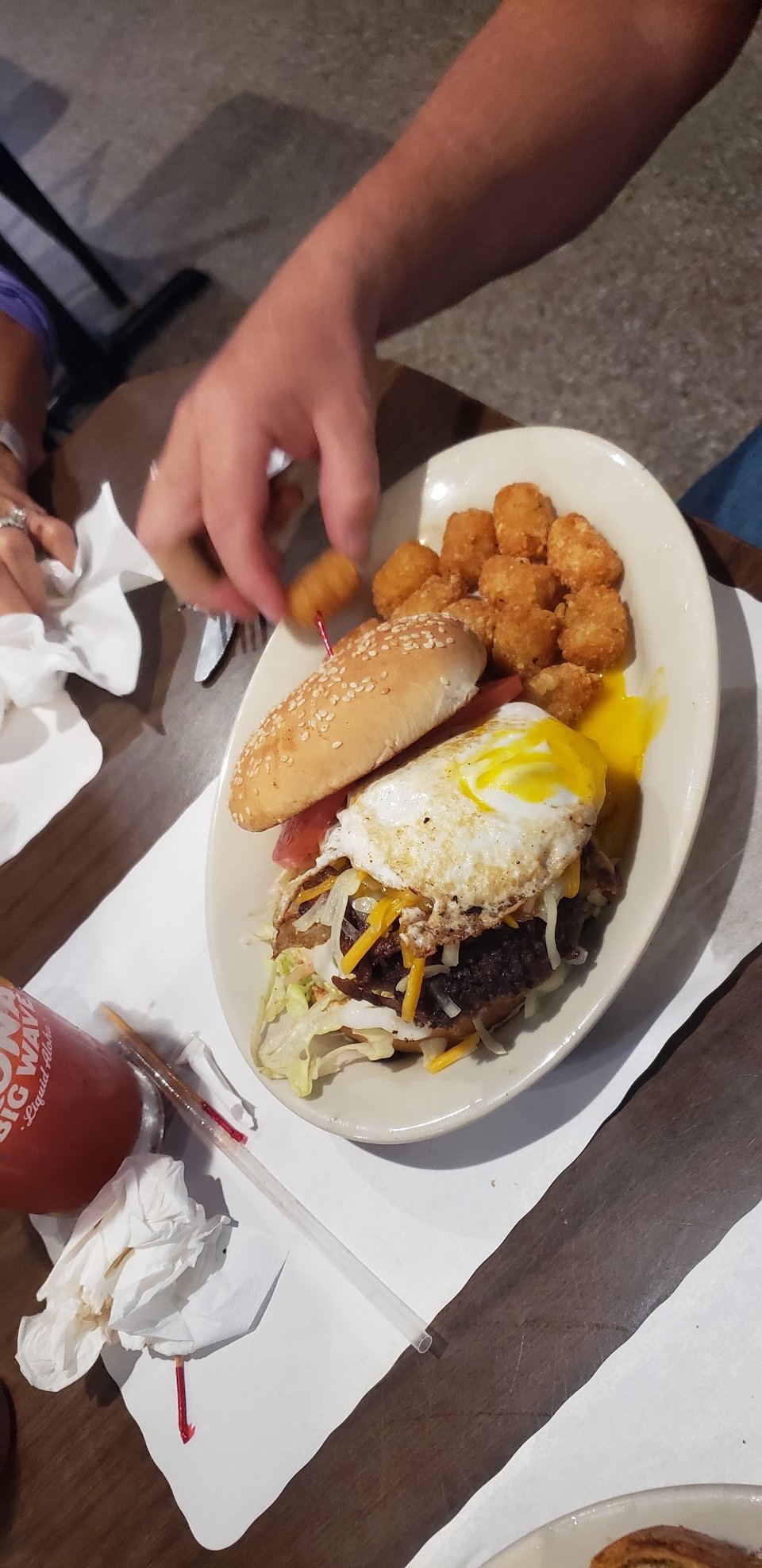 Burger, chicken, and breakfast sections on display.