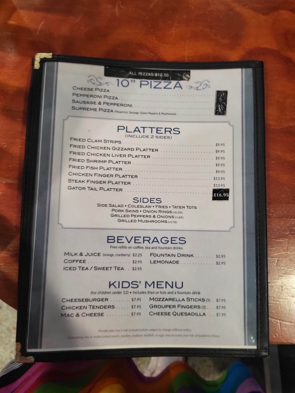 Printed menu with comfort food and quick bites.